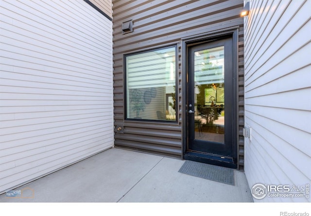 entrance to property featuring a patio