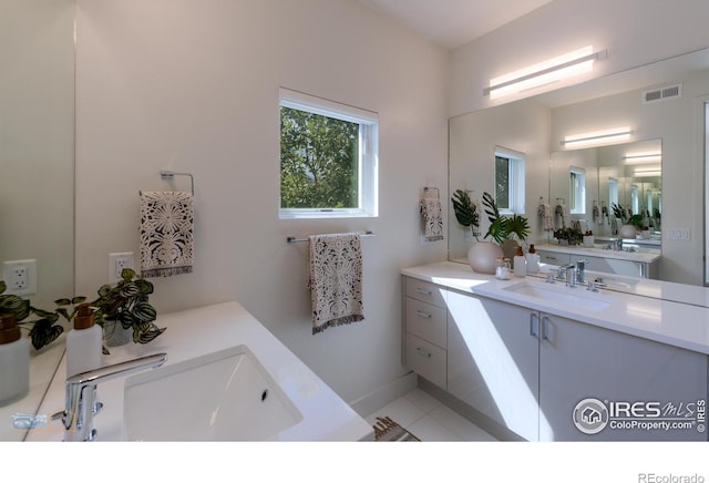 bathroom with vanity and tile patterned floors