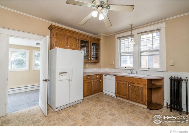 kitchen with crown molding, a baseboard heating unit, white appliances, ceiling fan, and radiator