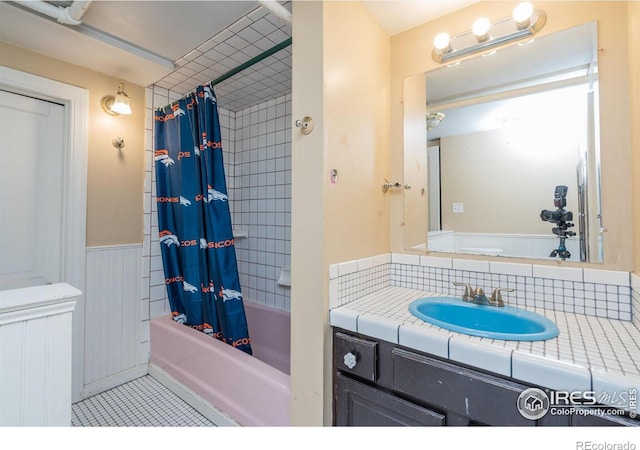 bathroom with vanity, tasteful backsplash, tile patterned flooring, and shower / bath combo with shower curtain