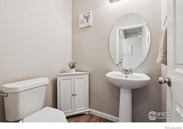 bathroom with sink and toilet