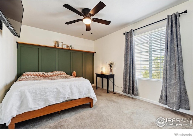 carpeted bedroom featuring ceiling fan