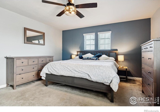 carpeted bedroom featuring ceiling fan