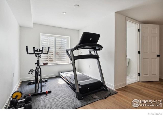 workout area featuring hardwood / wood-style floors