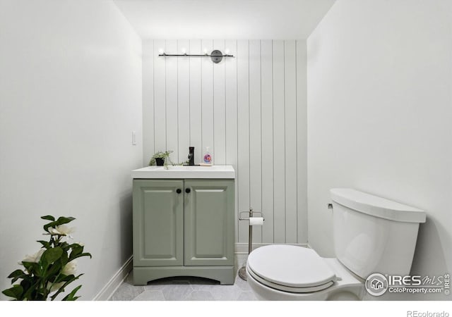 bathroom with toilet and vanity