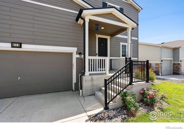 view of front of house with a porch and a garage