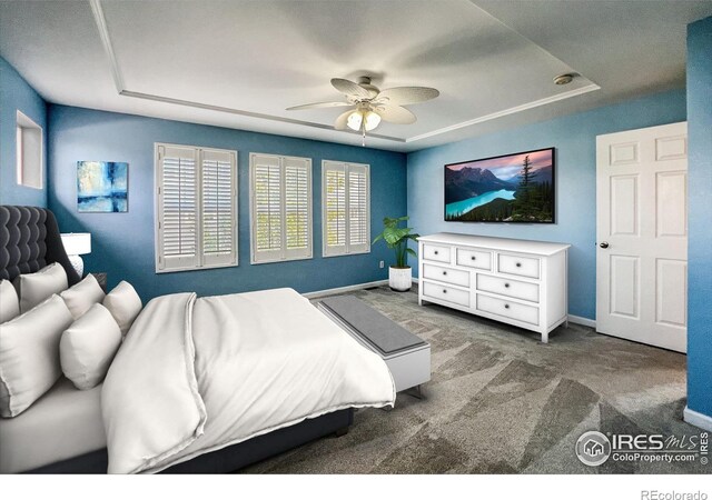 bedroom featuring carpet flooring, ceiling fan, and a raised ceiling