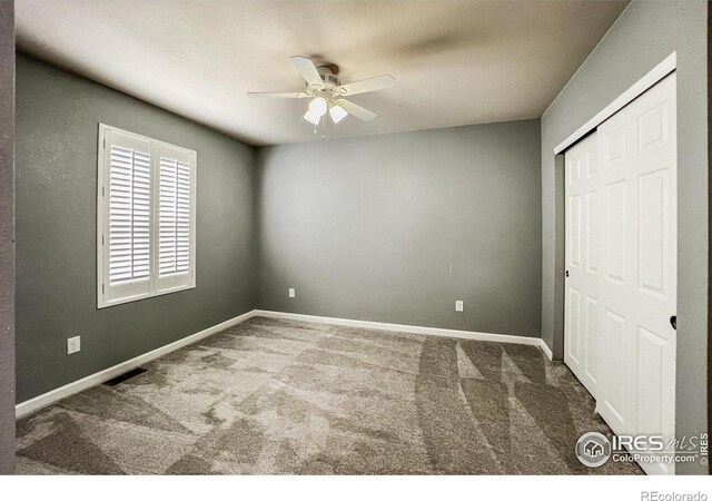 unfurnished bedroom featuring a closet, ceiling fan, and carpet floors