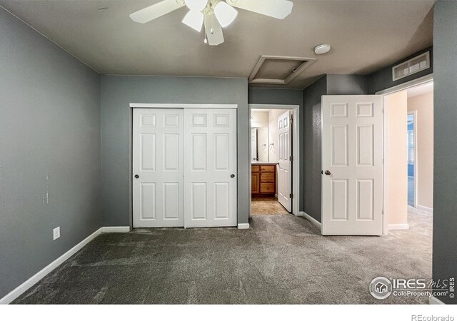 unfurnished bedroom featuring a closet, ceiling fan, connected bathroom, and carpet