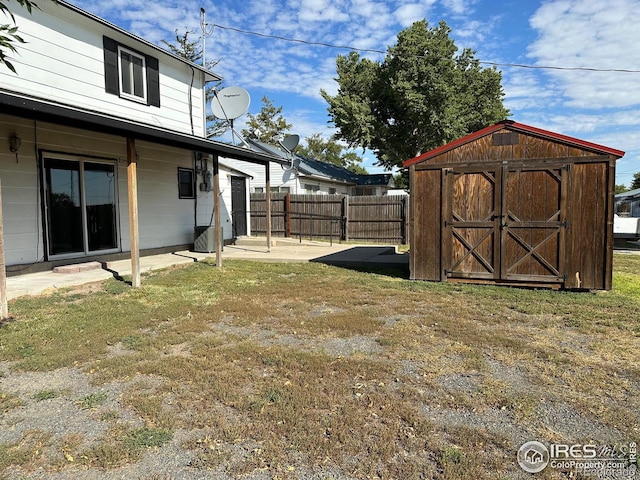 view of yard with a patio area and a shed