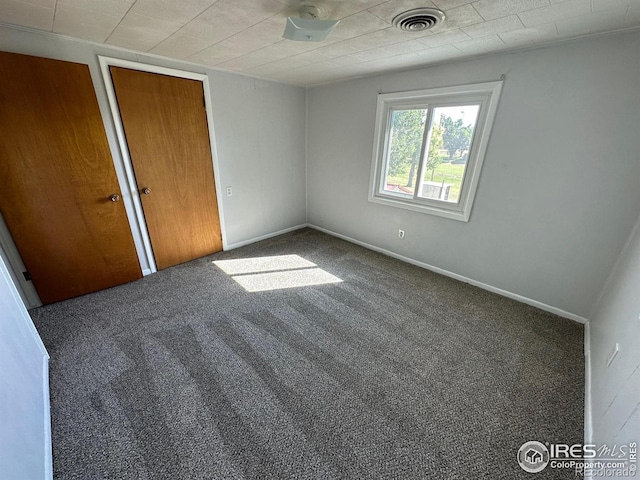 unfurnished bedroom featuring carpet