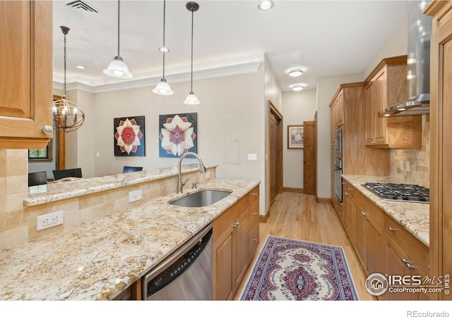 kitchen with light hardwood / wood-style flooring, stainless steel appliances, sink, light stone counters, and wall chimney range hood