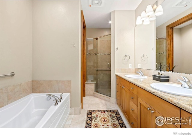 bathroom featuring vanity, tile patterned floors, and shower with separate bathtub