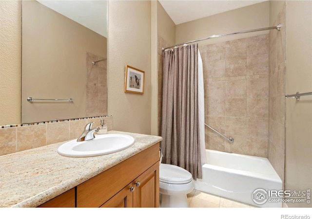 full bathroom featuring vanity, shower / tub combo, toilet, tile patterned floors, and decorative backsplash