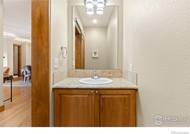 bathroom featuring vanity and wood-type flooring