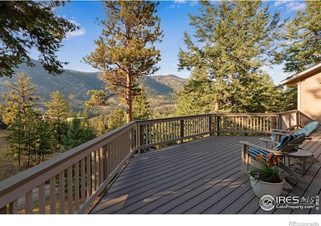 wooden terrace with a mountain view