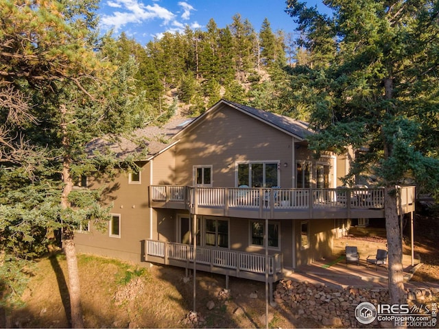 rear view of property with a deck