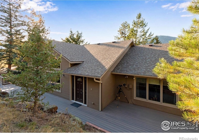 view of front of house with a wooden deck