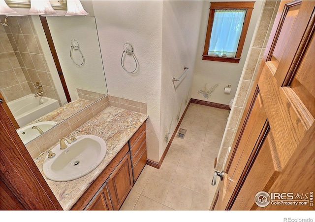 full bathroom featuring vanity, plus walk in shower, tile patterned flooring, and toilet