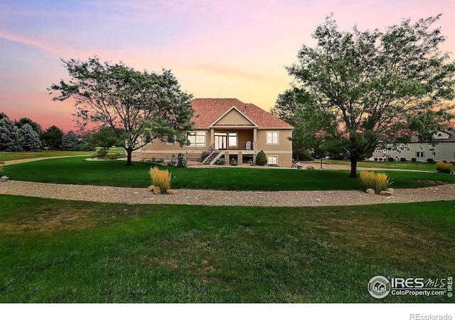 view of front of home featuring a yard