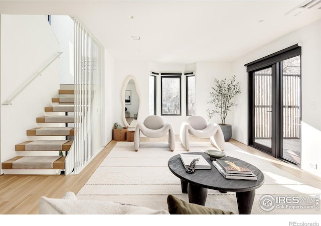 living room with light hardwood / wood-style flooring