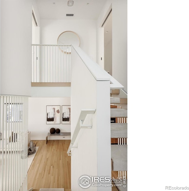 staircase featuring hardwood / wood-style flooring