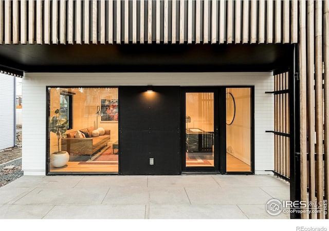 doorway to property with a patio