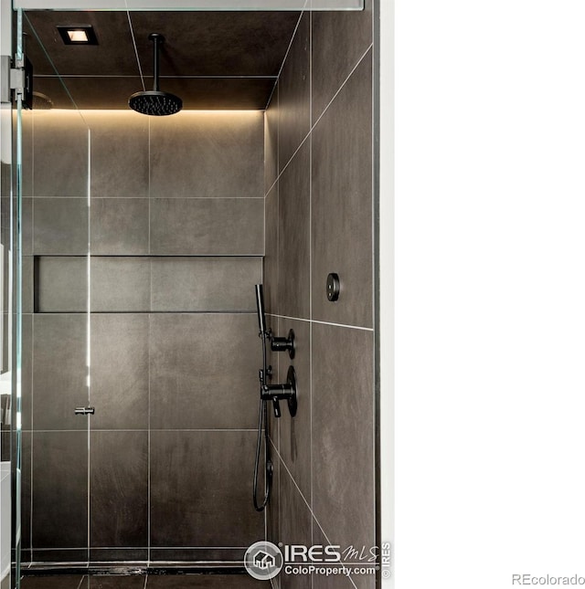 room details with a tile shower