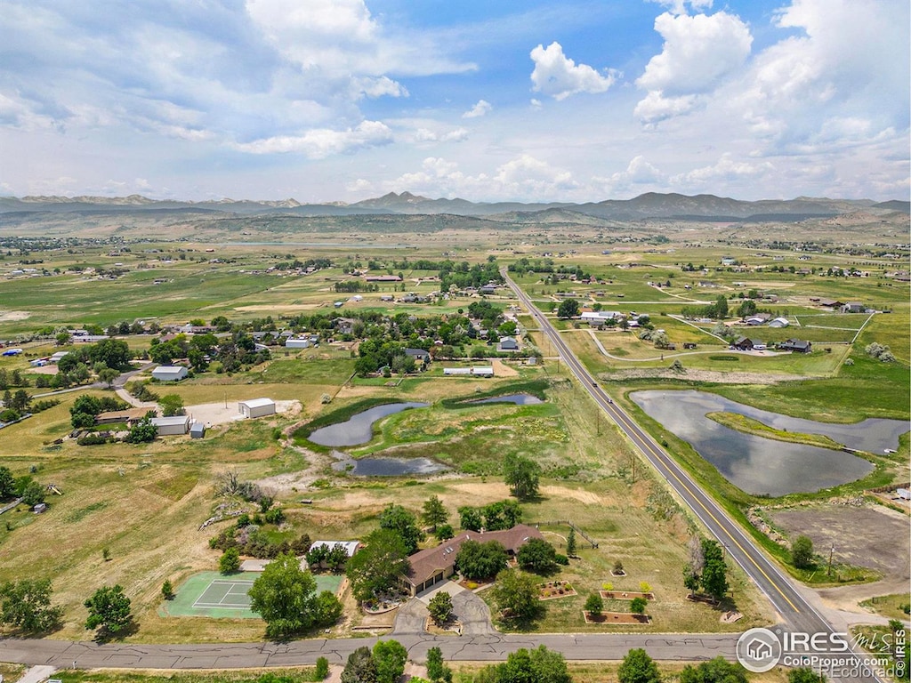 bird's eye view with a water and mountain view