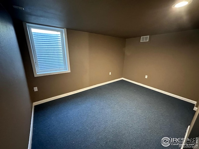 view of carpeted spare room