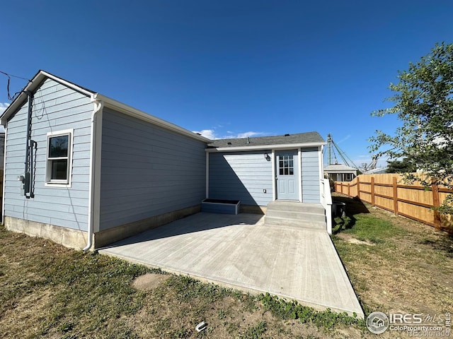 rear view of property featuring a patio area