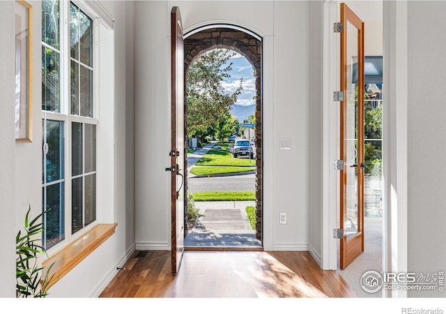 entryway with french doors and light wood-type flooring