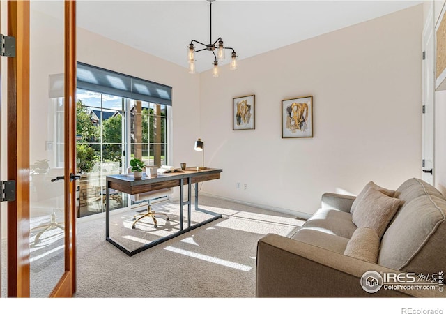 home office with french doors, a notable chandelier, and carpet