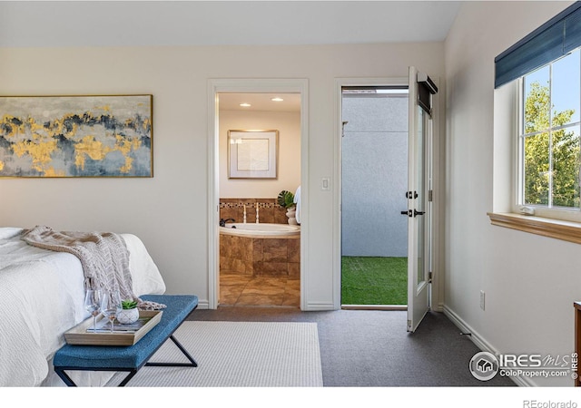 carpeted bedroom with connected bathroom