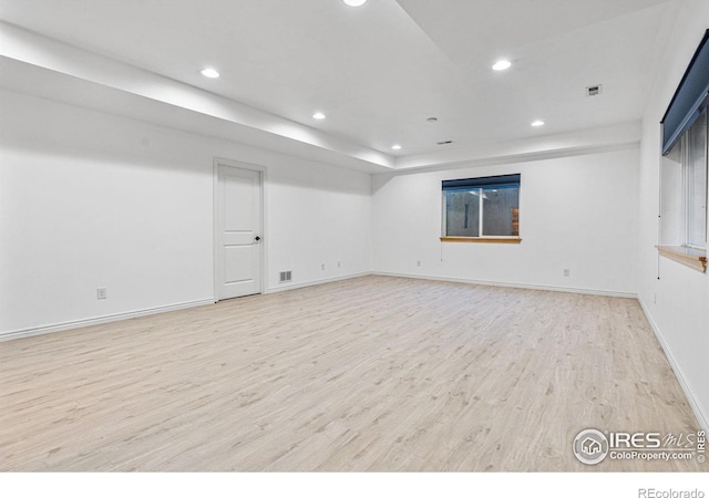 unfurnished room with light hardwood / wood-style floors