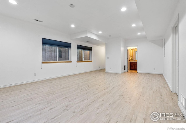 unfurnished living room featuring light wood-type flooring