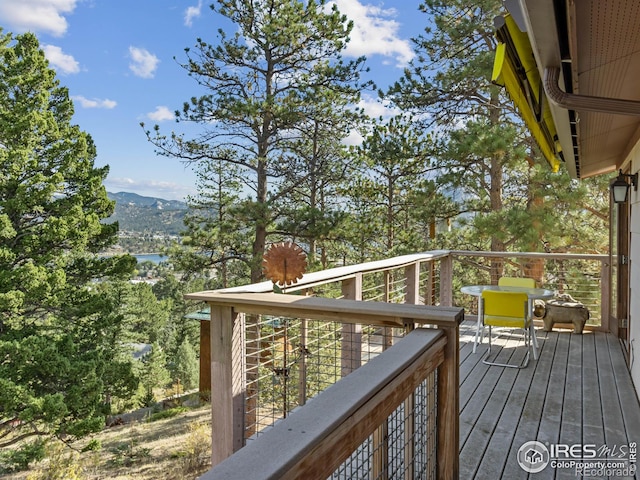 wooden deck featuring a water view