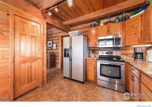 kitchen with wood ceiling, light stone counters, beamed ceiling, track lighting, and stainless steel appliances