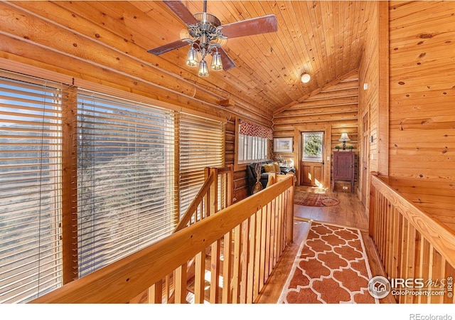 hall with wood-type flooring, wood ceiling, and vaulted ceiling