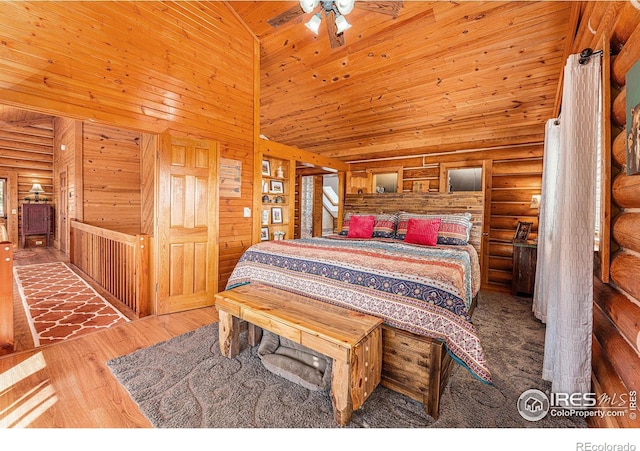 bedroom featuring wood ceiling, a towering ceiling, and dark hardwood / wood-style flooring