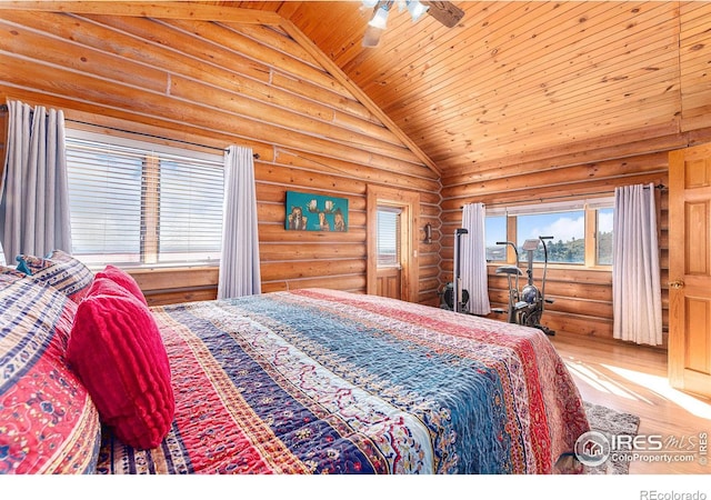 bedroom with ceiling fan, wood ceiling, hardwood / wood-style floors, log walls, and vaulted ceiling