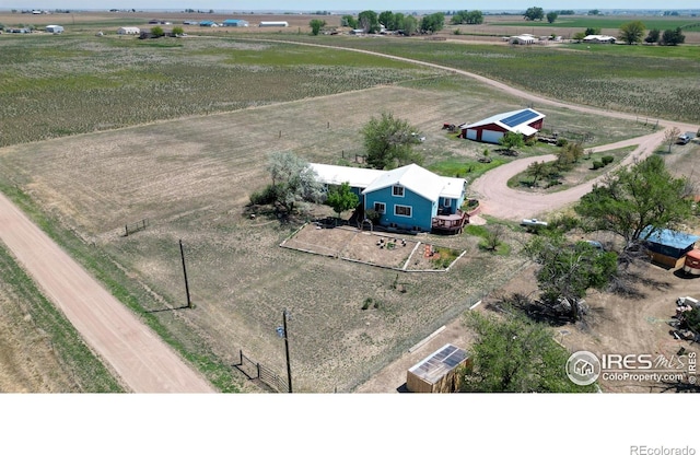 birds eye view of property featuring a rural view