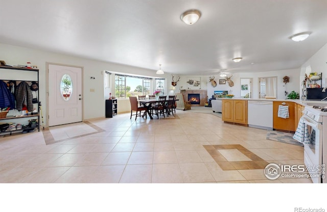 kitchen featuring white appliances and light tile patterned floors