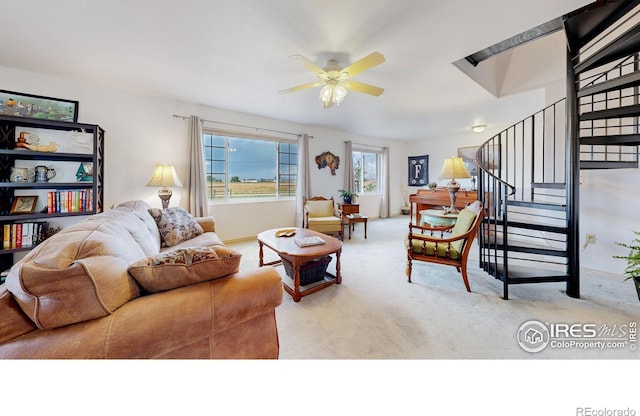 living room with light colored carpet and ceiling fan