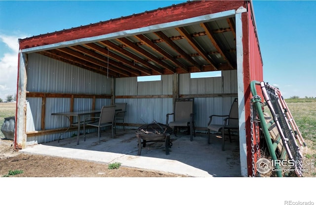 view of patio / terrace with an outbuilding