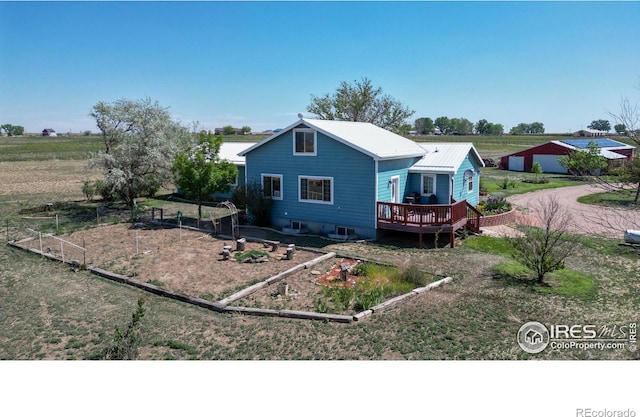 back of property featuring a wooden deck