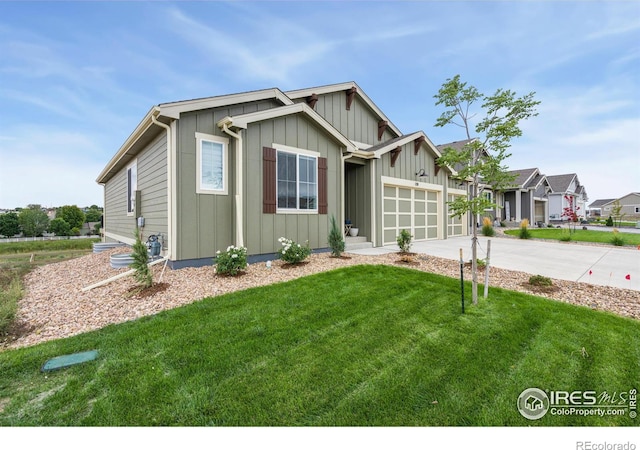 view of front facade with a front yard, an attached garage, board and batten siding, and driveway