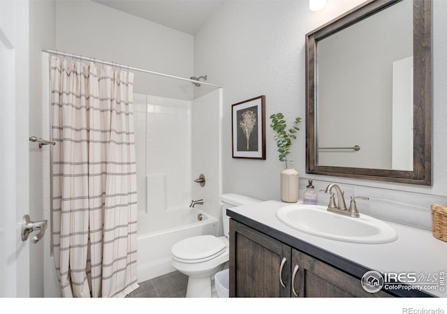 bathroom featuring vanity, toilet, and shower / bath combo with shower curtain