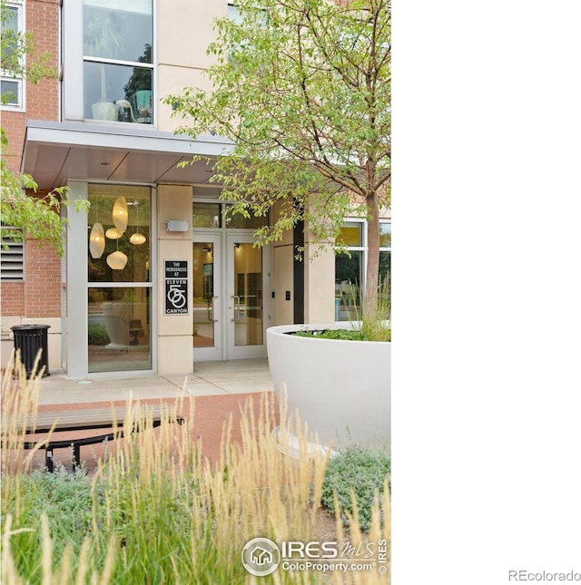 property entrance featuring french doors