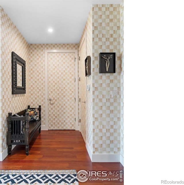 corridor featuring dark hardwood / wood-style flooring